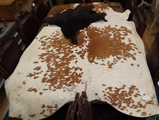 A pony skin rug and four goat skin mats, pony skin, 200 x 180cm